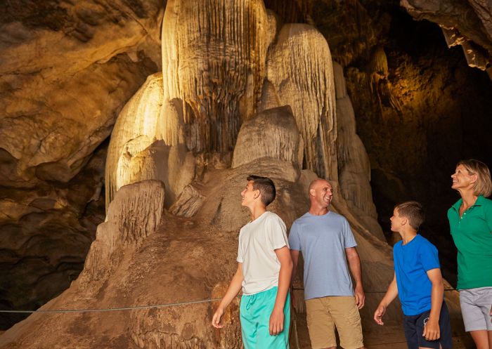 Family exploring the cave systems at Wellington Caves and Phosphate Mines, Wellington